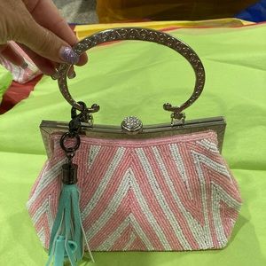 Pink and white handbag with green tassel keyring hybrid charging cable